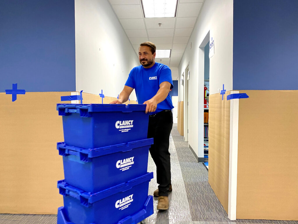 worker pushing the boxes out
