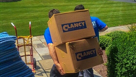 movers carrying boxes