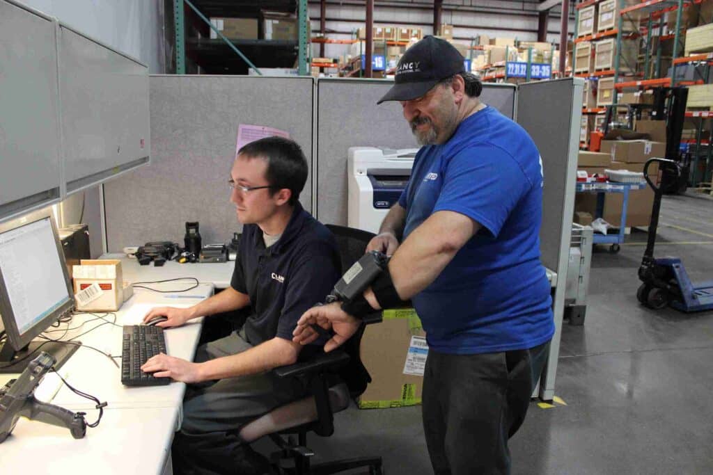 two workers checking the system