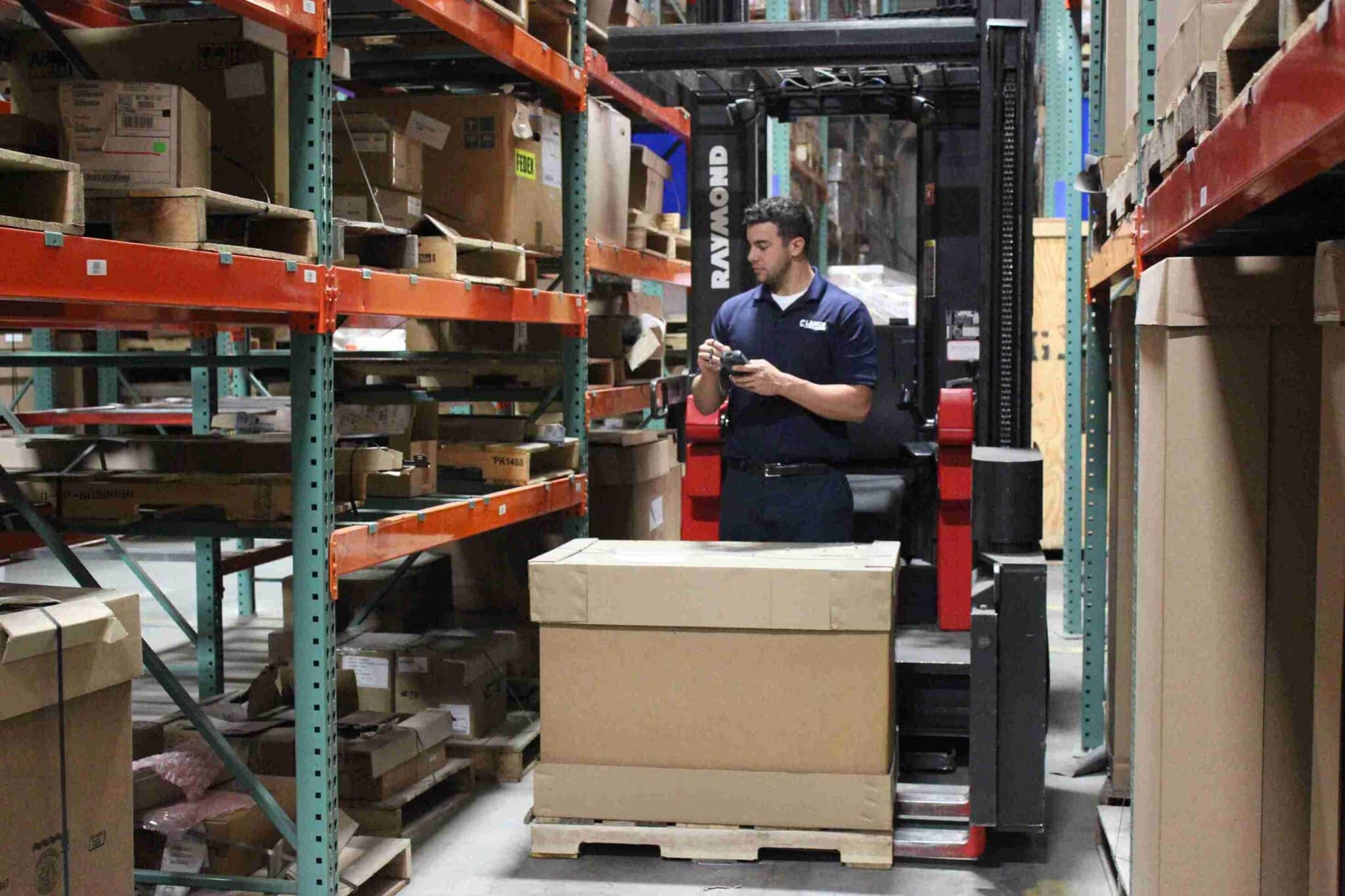 worker checking inventory in the warehouse