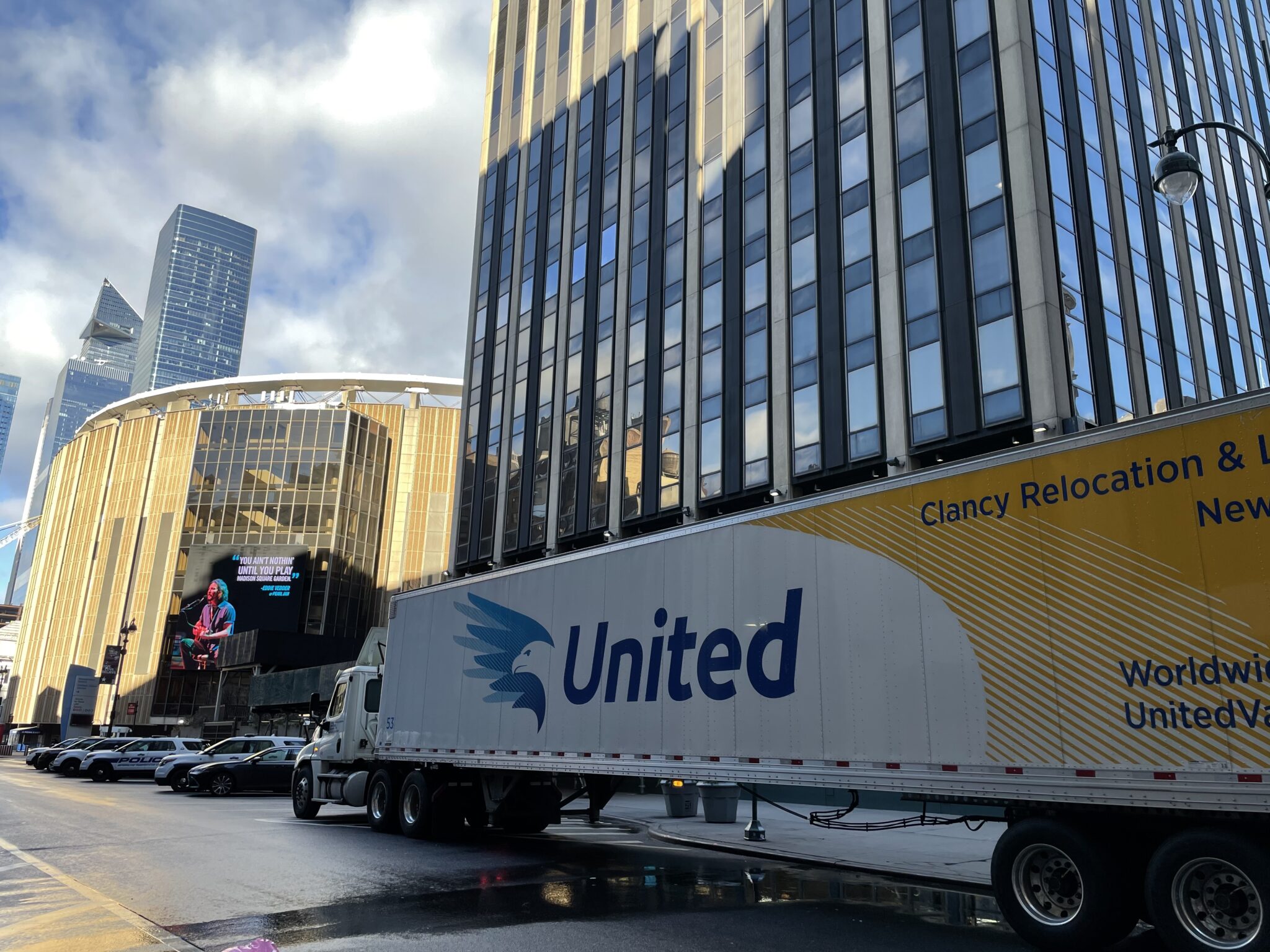 A tuck from Clancy Relocation & Logistics moving through high-rise building.