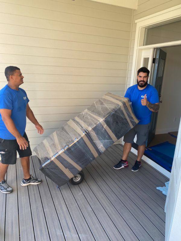 Clancy moving wrapped furniture